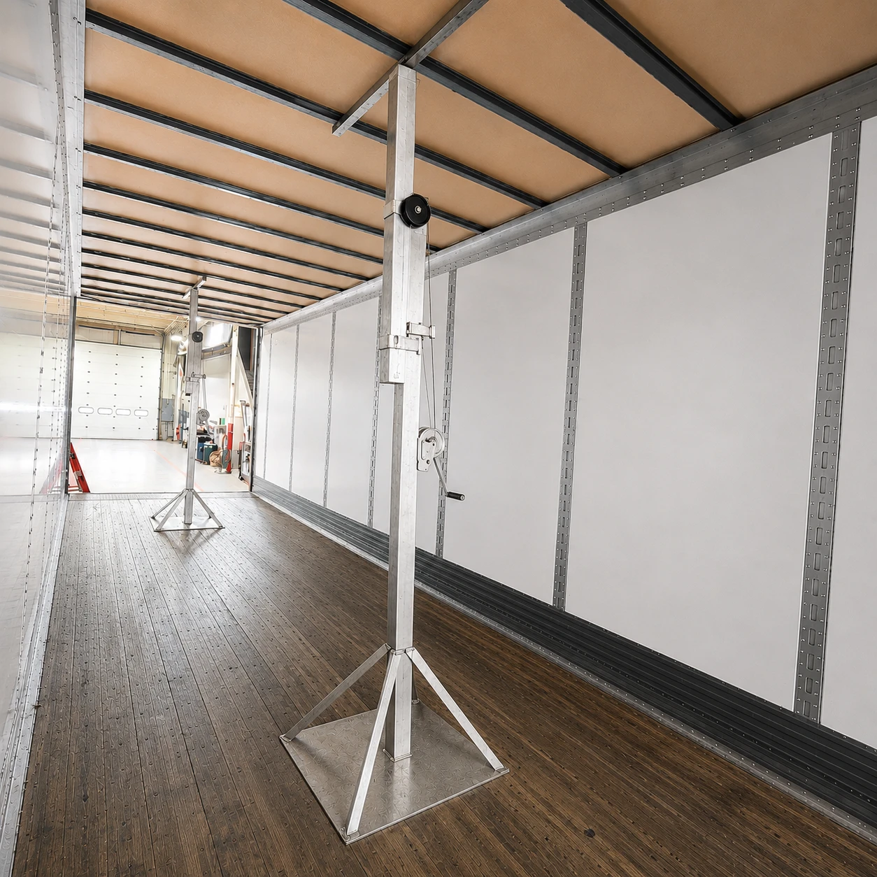 Two TRSS supports holding the roof inside a trailer during a repair